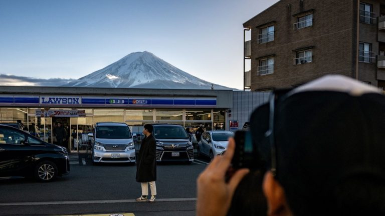 REPORTING.  To calm the onslaught of tourists on Mount Fuji in Japan, access becomes paying