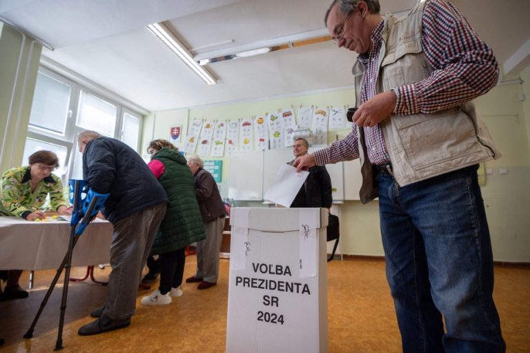 Slovaks elect their president in a close vote, with Ukraine in the background