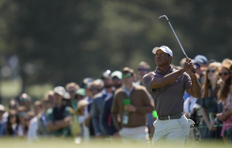 Woods avoids the ax in a record 24th appearance in a row at the Masters