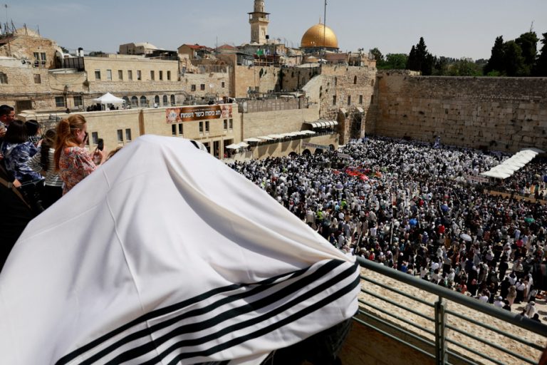 Worshipers attend a Passover blessing at the Western Wall