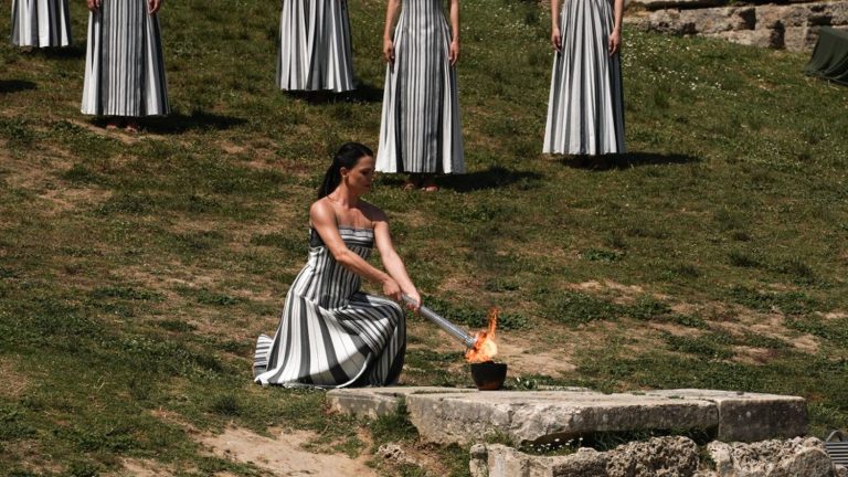 follow the Olympic flame lighting ceremony