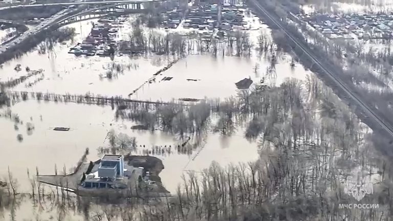 in the Urals, helpless residents watch the flood rise