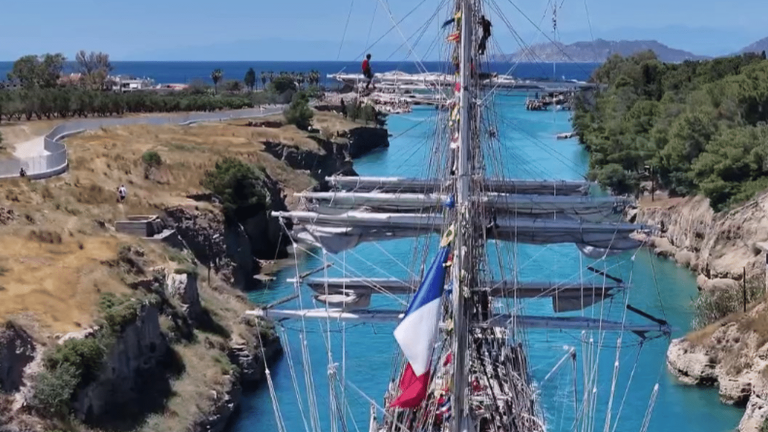 the magical crossing of the Olympic flame through the Corinth Canal