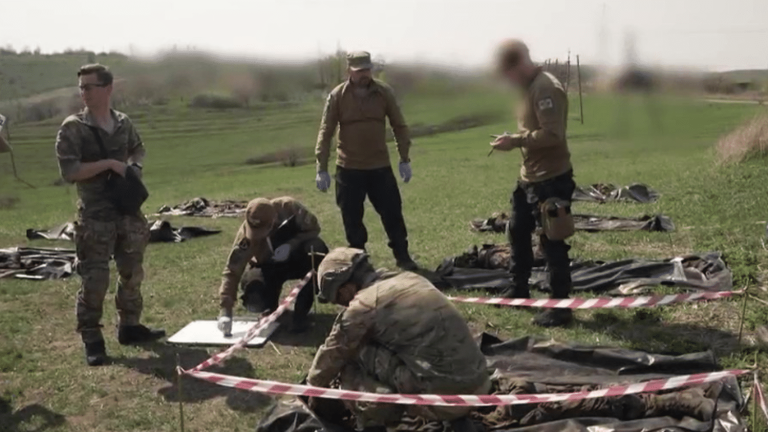 volunteers travel the front to recover the remains of killed soldiers