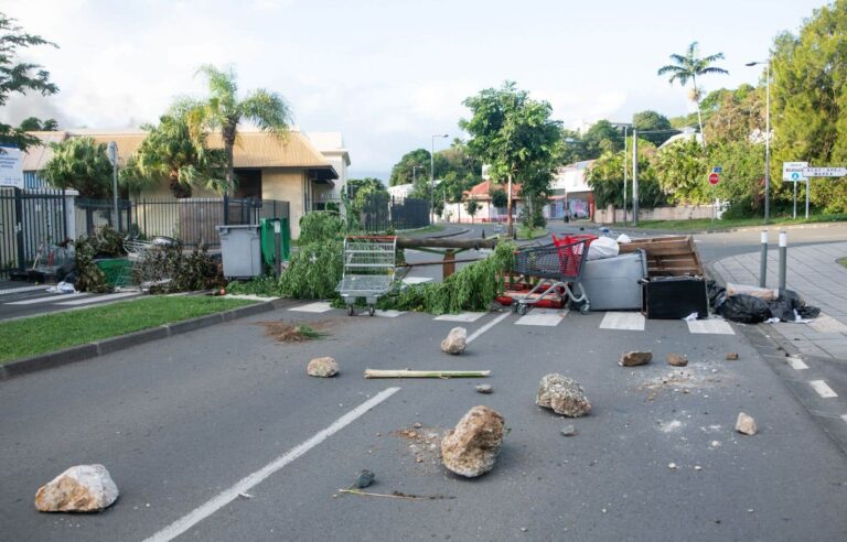 In New Caledonia, groups of residents set up barricades and checkpoints to “defend themselves”