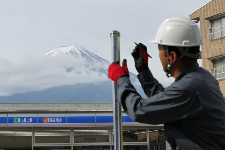 Overtourism |  A net installed to hide the view of Mount Fuji