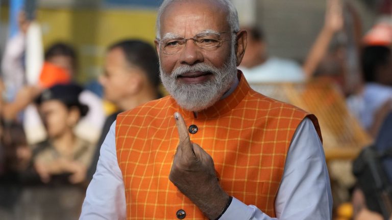 Prime Minister Narendra Modi votes in his home state of Gujarat