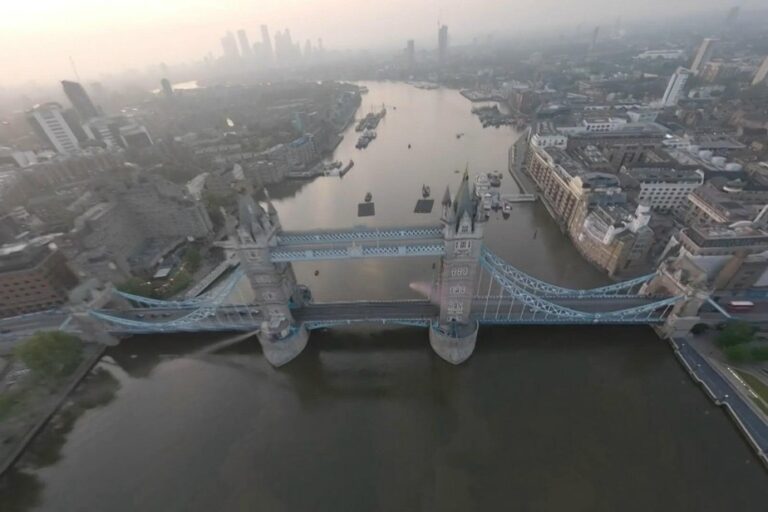 Two skydivers wingsuit jump across London Bridge