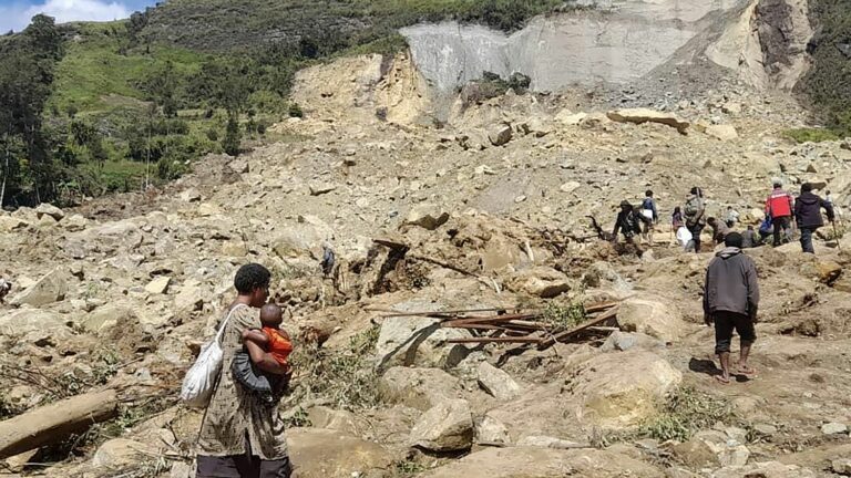 humanitarian aid arrives at landslide site, where 2,000 people were buried