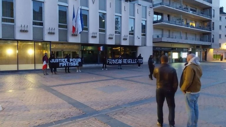 on the eve of the white march, identity activists displayed banners in front of Châteauroux town hall