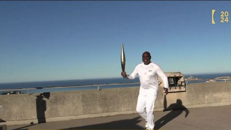 the torch relay begins in Marseille with ex-footballer Basile Boli