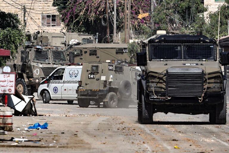 Occupied West Bank |  Israeli soldiers tie Palestinian to military vehicle