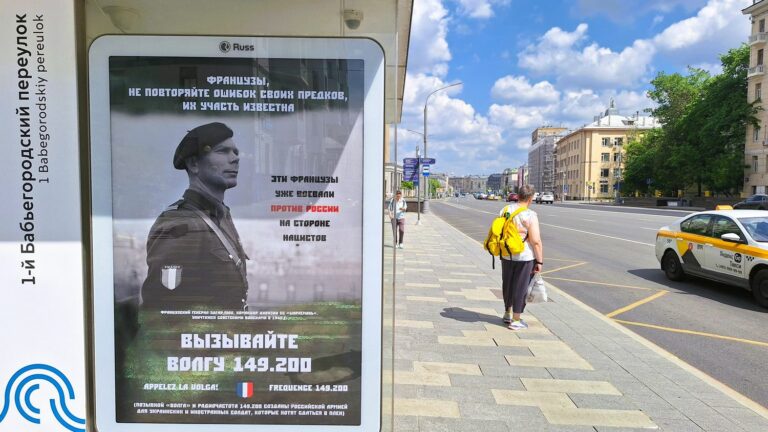 Posters comparing French soldiers to Nazi collaborators around the French embassy in Moscow