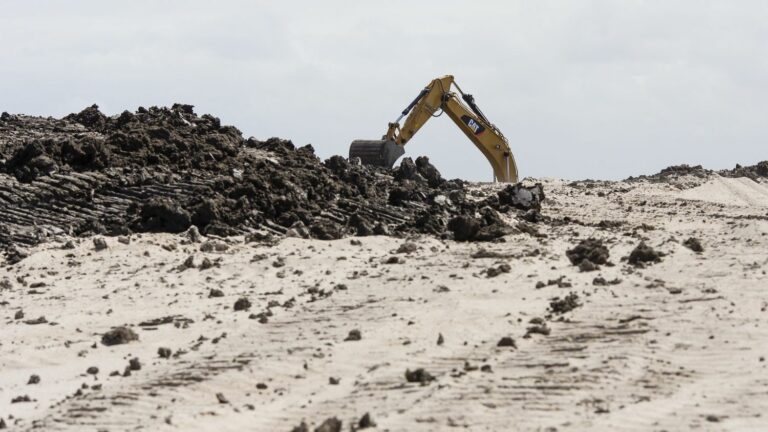 REPORTING.  In the Maldives, taking sand raises the land but destroys the marine environment