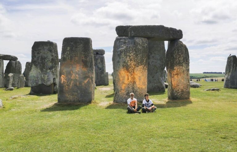 Two environmentalists arrested after spraying paint on Stonehenge monoliths in UK