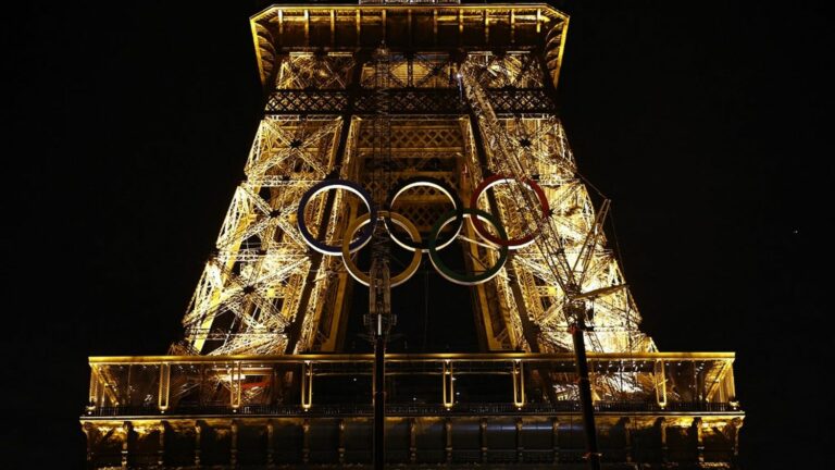 the Eiffel Tower is adorned with the Olympic rings