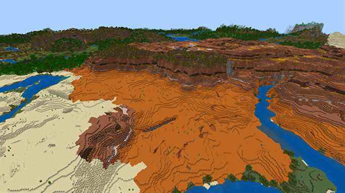 Une vue de haut en bas d'un biome de Badlands dans Minecraft Bedrock, avec l'entrée d'un ravin au premier plan ci-dessous.