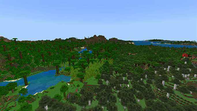 Un paysage Minecraft Bedrock couvert de forêts, avec Jungle à gauche, forêt de bouleaux à droite et montagnes en arrière-plan.