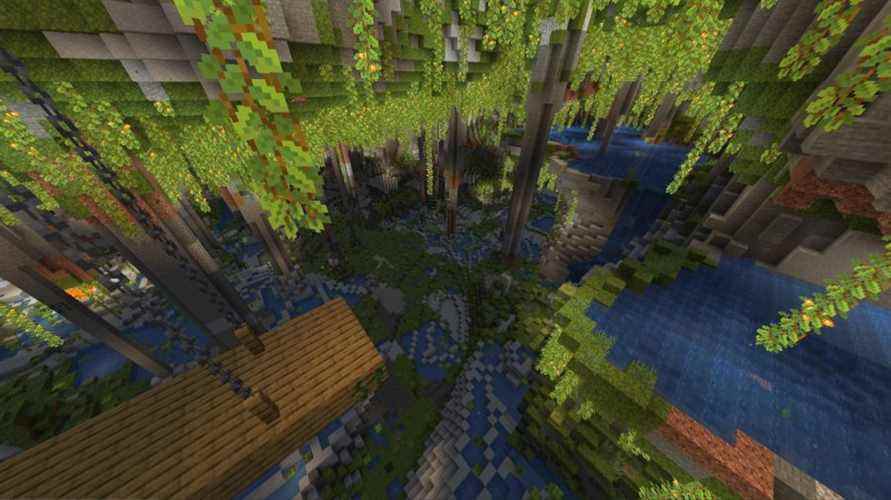 Une graine de grotte luxuriante Minecraft avec des bassins d'eau et un puits de mine