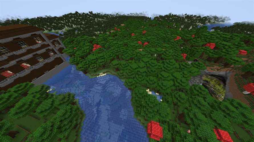 Un manoir boisé sur les rives d'une rivière à Minecraft, en face d'une grotte luxuriante