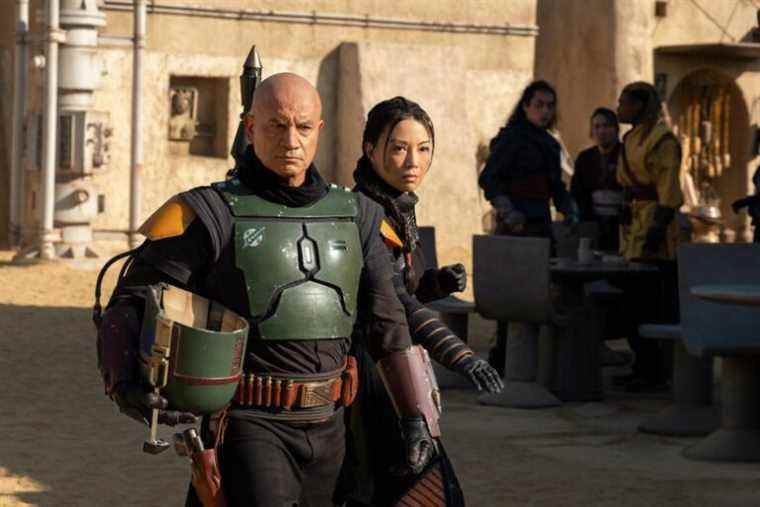 (L-R): Boba Fett (Temura Morrison) and Fennec Shand (Ming-Na Wen) in Lucasfilm's THE BOOK OF BOBA FETT, exclusively on Disney+. © 2021 Lucasfilm Ltd. & ™. All Rights Reserved.