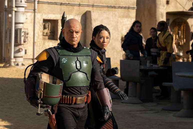 (L-R): Boba Fett (Temura Morrison) and Fennec Shand (Ming-Na Wen) in Lucasfilm's THE BOOK OF BOBA FETT, exclusively on Disney+. © 2021 Lucasfilm Ltd. & ™. All Rights Reserved.