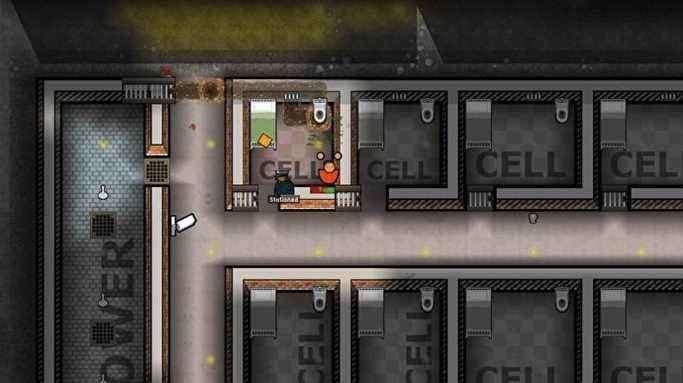 Une vue de haut en bas de plusieurs cellules de prison dans Prison Architect