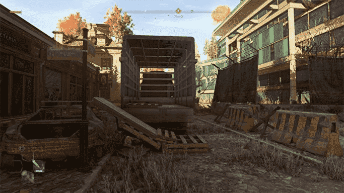 Une capture d'écran de Dying Light 2, montrant une rue abandonnée sans effets de lancer de rayons.