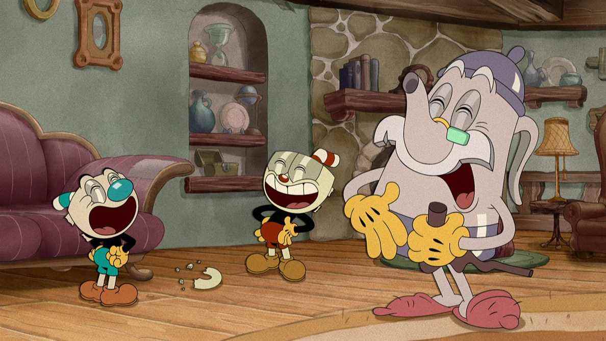 Cuphead, Elder Kettle et Mugman rient dans leur salon 