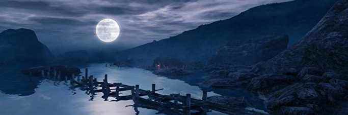 Un plan large d'un paysage nocturne de Dear Esther, une énorme lune éclairant une petite plage rocheuse, avec les os d'une jetée en bois sortant de l'eau au premier plan