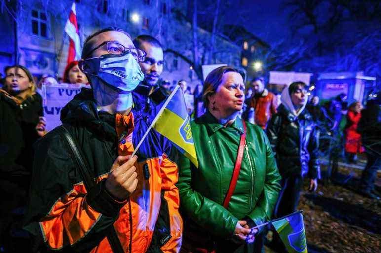 A member of Ukrainian community seen with a flag during the demonstration. Following the beginning of the Russian invasion of Ukraine, members of the Ukrainian community and supportive Poles and Belarusians protested near diplomatic missions of the Russian Federation to express their opposition to Russian military aggression. In Krakow, where Ukrainian immigration is particularly numerous, several thousand people gathered in front of the Russian consulate. (Photo by Filip Radwanski / SOPA Images/Sipa USA)(Sipa via AP Images)