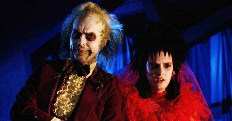 Winona Ryder in a red wedding dress next to Beetlejuice