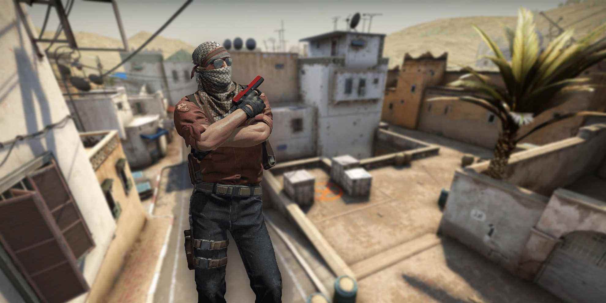 A CS:GO Terrorist showing his pistol with Dust 2 in the background