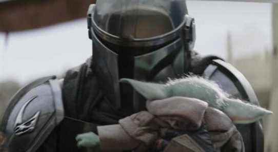 Grogu hugs the Mandalorian in The Book of Boba Fett