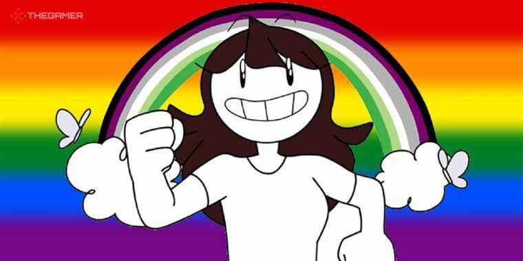 Jaiden animations in front of an LGBT flag background and a rainbow