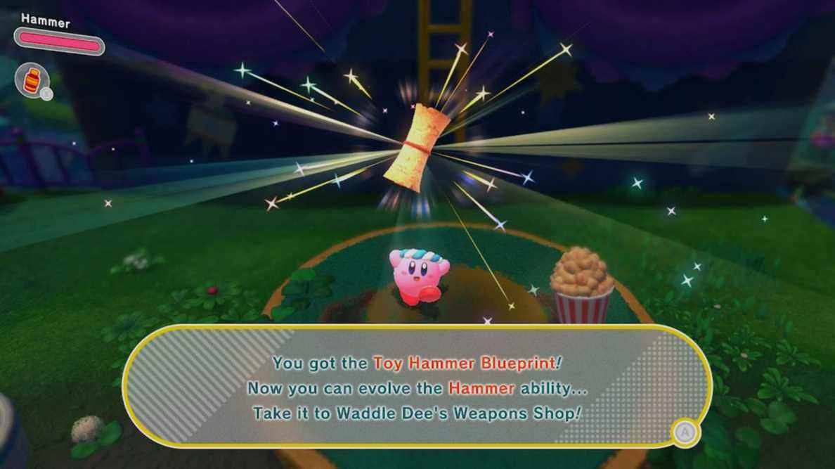 Kirby attrape avec enthousiasme un plan Toy Hammer sur un piédestal 