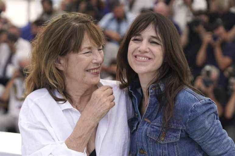 Jane Birkin, left, and Charlotte Gainsbourg pose for photographers at the photo call for the film 'Jane By Charlotte' at the 74th international film festival, Cannes, southern France, Thursday, July 8, 2021. (AP Photo/Brynn Anderson)