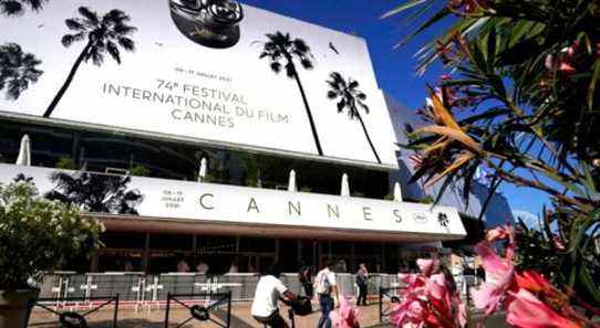 Members of the public walk in front of the Palais des Festival prior to the 74th international film festival, Cannes, southern France, July 5, 2021. The Cannes film festival runs from July 6 - July 17, 2021. (AP Photo/ Brynn Anderson)