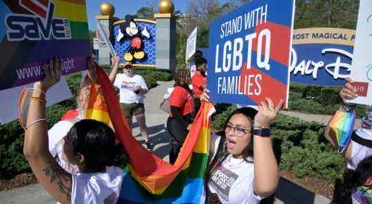 IMAGE DISTRIBUTED FOR AIDS HEALTHCARE FOUNDATION - Advocates march at a rally at the Walt Disney Company in Orlando, Fla., spearheaded by advocates from AIDS Healthcare Foundation (AHF) on Thursday, March 3, 2022, in Orlando, Fla. The advocates targeted Disney in two near-simultaneous rallies in Orlando and Burbank, Calif., to urge Disney to publicly speak out to oppose Florida's hateful, homophobic "Don't Say Gay" bill targeting LGBTQ+youth, their families, teachers and school counselors that is currently pending in the Florida legislature. (Phelan M. Ebenhack/AP Images for AIDS Healthcare Foundation)