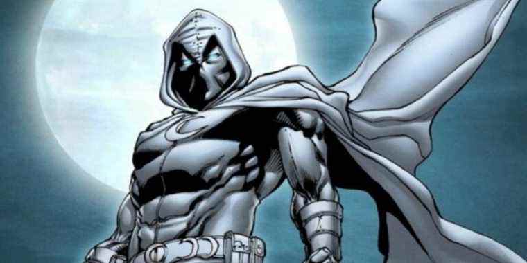 Moon Knight standing in front of the moon in his signature outfit