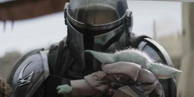 Grogu hugs the Mandalorian in The Book of Boba Fett