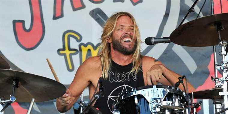 Foo Fighters Taylor Hawkins playing smile