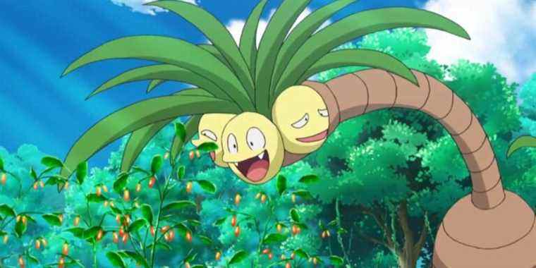 An Alolan Exeggutor bending down to eat some berries in the Pokemon anime