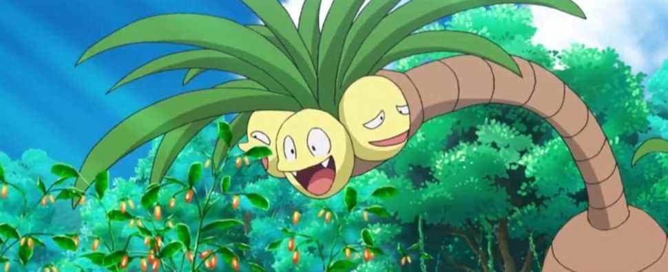 An Alolan Exeggutor bending down to eat some berries in the Pokemon anime