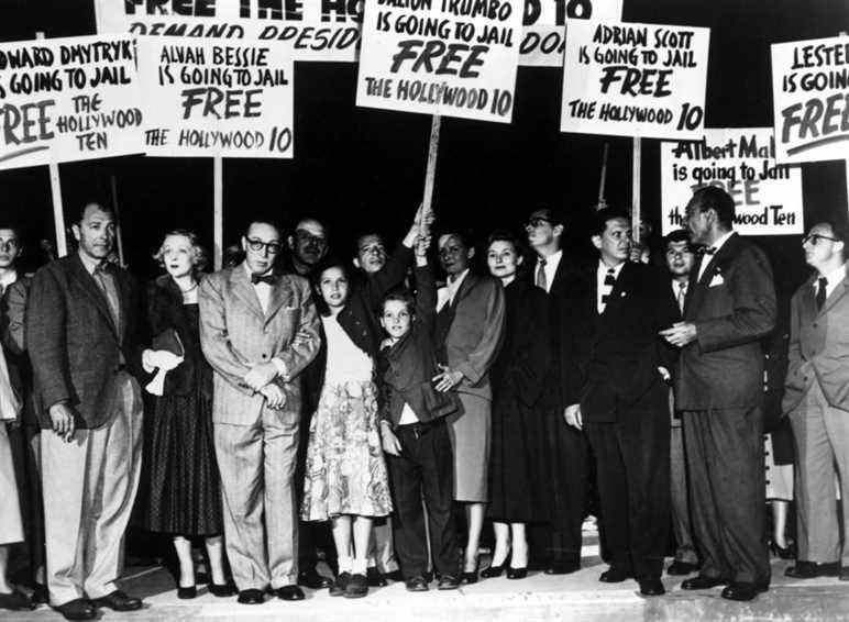 The Hollywood Ten stage a demonstration at the Los Angeles airport on their way to prison, Lester Cole, Dalton Trumbo, Alvah Bessie, Nicole Trumbo, Christopher Trumbo, Cleo Trumbo, Mrs. Ring Lardner Jr., Ring Lardner Jr., Ben Margolis, Herbert Biberman