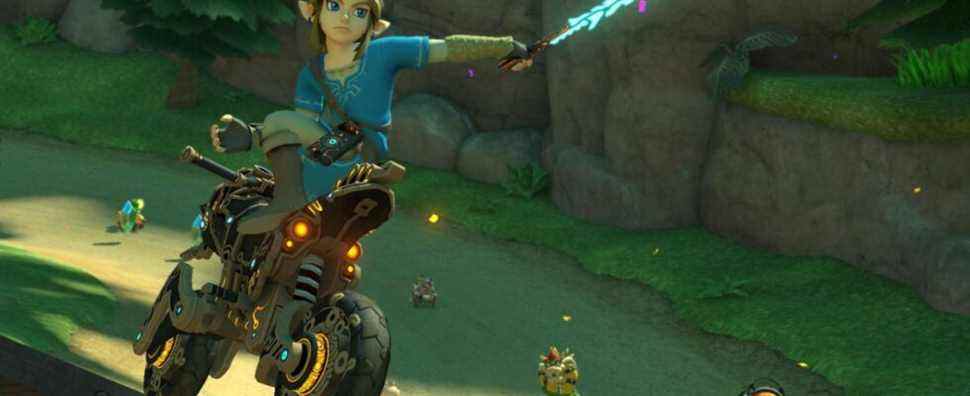 Link holding a Guardian Sword in a Mario Kart 8 Deluxe race, with Rosalina, Bowser, and an Inkling in the background