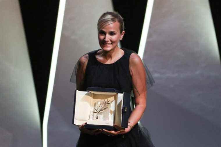 Julia Ducournau poses with the Palme d'Or 'Best Movie Award' for 'Titane' Closing Ceremony, during the 74th International Cannes Film Festival, at Palais des Festivals, Cannes FRANCE - 17/07/2021 (Sipa via AP Images)