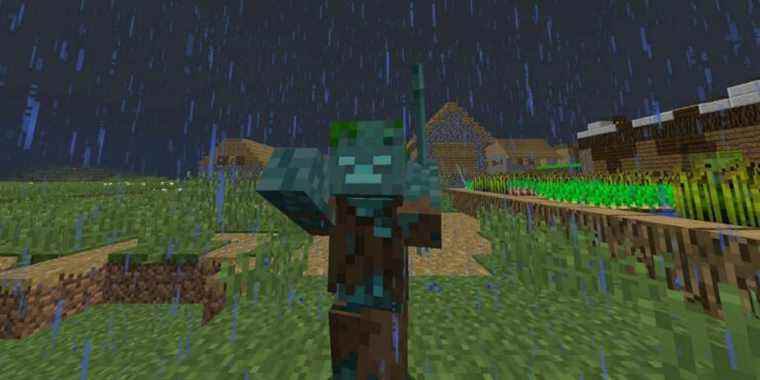 A Drowned zombie standing in a Minecraft village during a rainy night