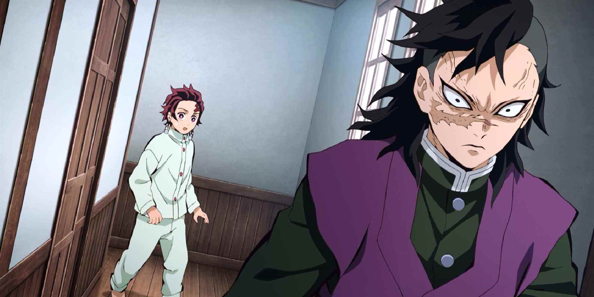 Demon Slayer - Tanjiro regarde un Genya en colère