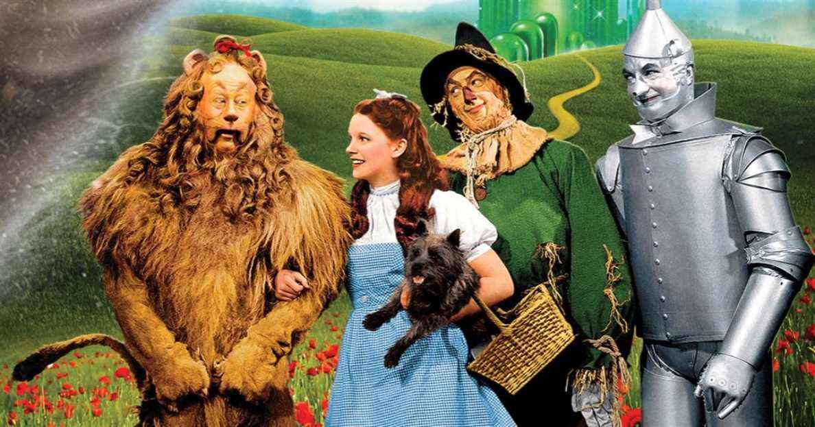 The cast of The Wizard of Oz on the yellow brick road